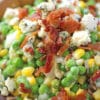 Ranch Bacon Pea Salad is the perfect summery side dish. Made with creamy ranch, lots of blue cheese and delicious, crispy bacon.