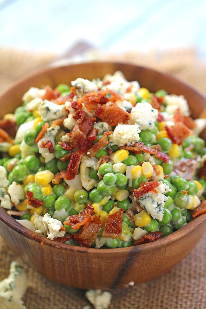 Creamy Ranch Bacon Pea Salad is the perfect summery side dish. Made with creamy ranch, lots of blue cheese and delicious, crispy bacon.