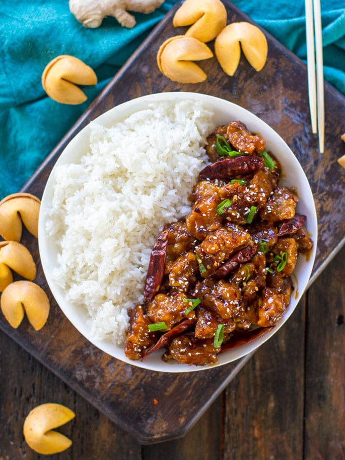 overhead shot of Chinese Sweet and Spicy Chicken with chilli peppers served with rice