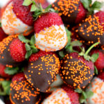 Halloween Chocolate Dipped Strawberries make for a refreshingly sweet and slightly tangy dessert using our favorite berries. Even kids can help prepare these! #halloween #strawberries #fallrecipes #30minutemeals #healthyrecipes