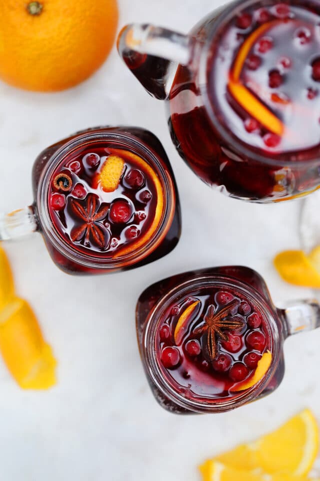 Orange Cranberry Sangria bursts with flavors reminiscent of autumn and winter! This makes for the perfect cocktail for upcoming holidays, with hints of orange and spices! #sangria #cranberrysangria #30minutemeals #fallrecipes #thanksgiving #christmas