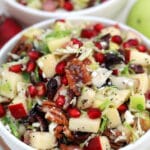 Brussels Sprouts Salad is a quick and easy side dish made with shredded brussels sprouts, crispy apples, cranberries, pomegranate arils, feta cheese, and pecans. #salad #thanksgiving #christmasrecipes #sidedish #30minutemeals