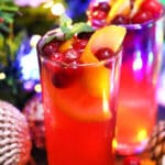 Christmas Punch is made with fresh cranberries, various juices, and sparkling water. #christmaspunch #christmasrecipes #drinks #30minutemeals #holidayrecipes