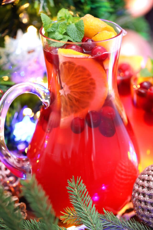 Christmas Punch is made with fresh cranberries, various juices, and sparkling water. #christmaspunch #christmasrecipes #drinks #30minutemeals #holidayrecipes