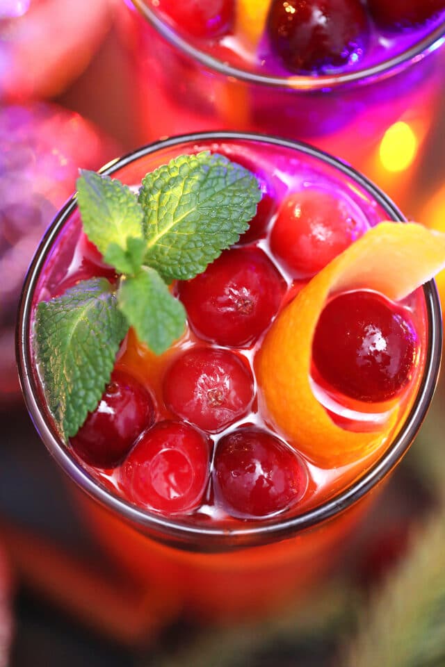 Christmas Punch is made with fresh cranberries, various juices, and sparkling water. #christmaspunch #christmasrecipes #drinks #30minutemeals #holidayrecipes