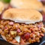 Philly Cheesesteak Sloppy Joes are made with ground beef, tender bell pepper, onions, and gooey melted cheese! #sloppyjoes #beefrecipes #easydinner #30minutemeals #phillycheesesteak