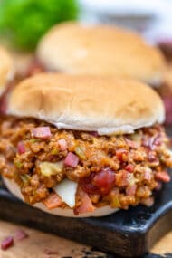 Philly Cheesesteak Sloppy Joes are made with ground beef, tender bell pepper, onions, and gooey melted cheese! #sloppyjoes #beefrecipes #easydinner #30minutemeals #phillycheesesteak
