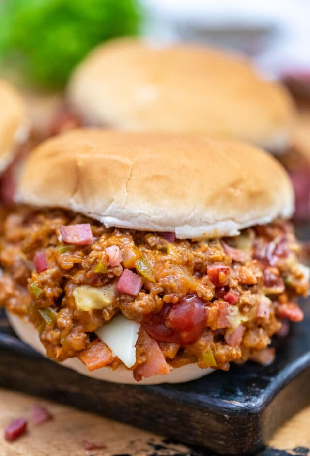 Philly Cheesesteak Sloppy Joes are made with ground beef, tender bell pepper, onions, and gooey melted cheese! #sloppyjoes #beefrecipes #easydinner #30minutemeals #phillycheesesteak