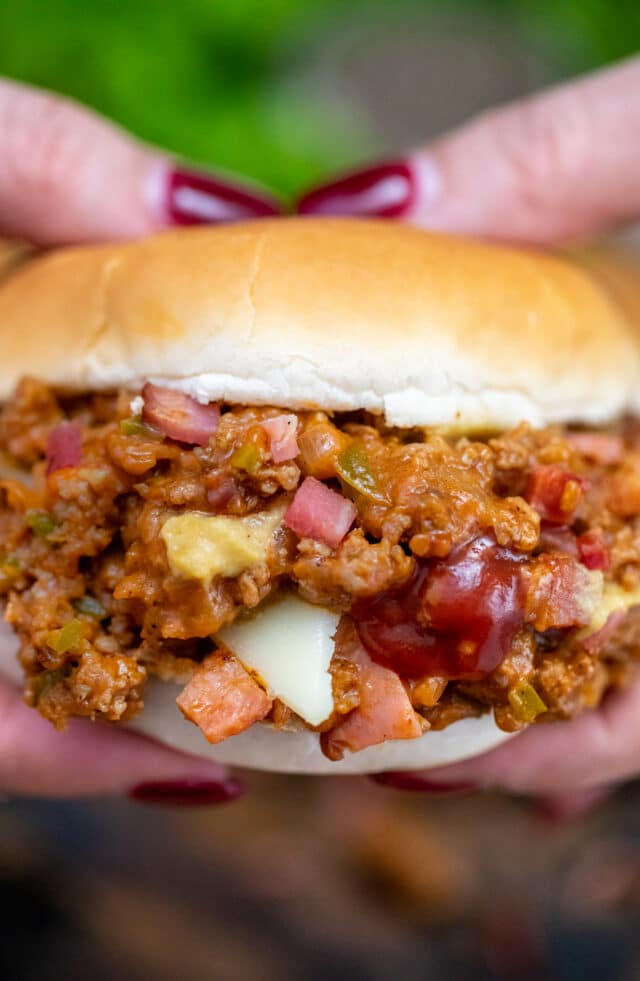 Philly Cheesesteak Sloppy Joes are made with ground beef, tender bell pepper, onions, and gooey melted cheese! #sloppyjoes #beefrecipes #easydinner #30minutemeals #phillycheesesteak