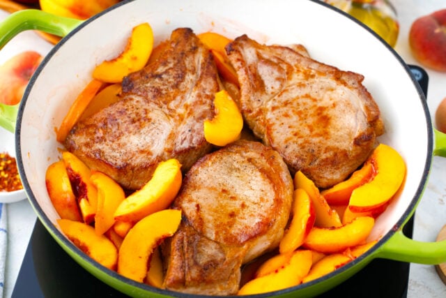 A pan of peach pork chops.