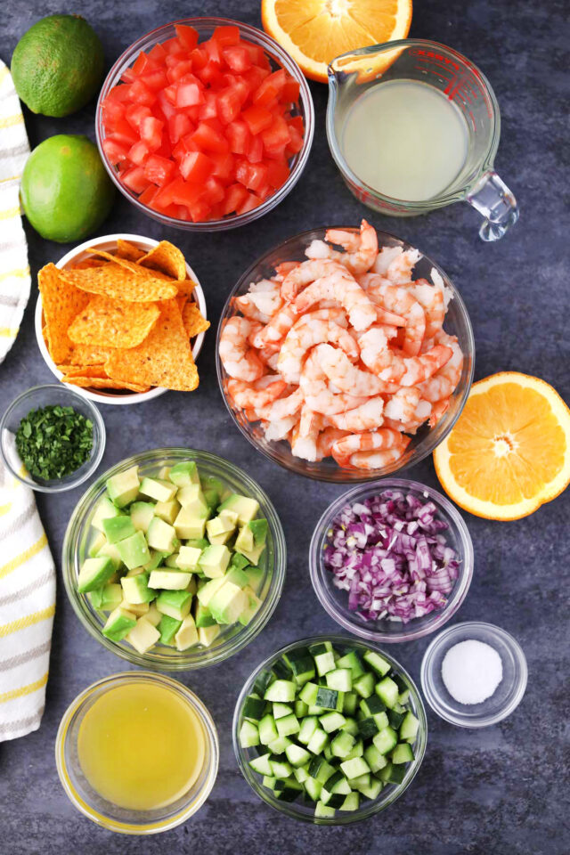 Overhead shot of shrimp ceviche ingredients in bowls.