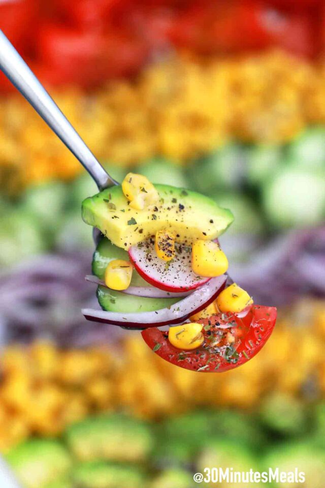 avocado corn salad on a fork