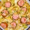 fried cabbage and kielbasa in a pan
