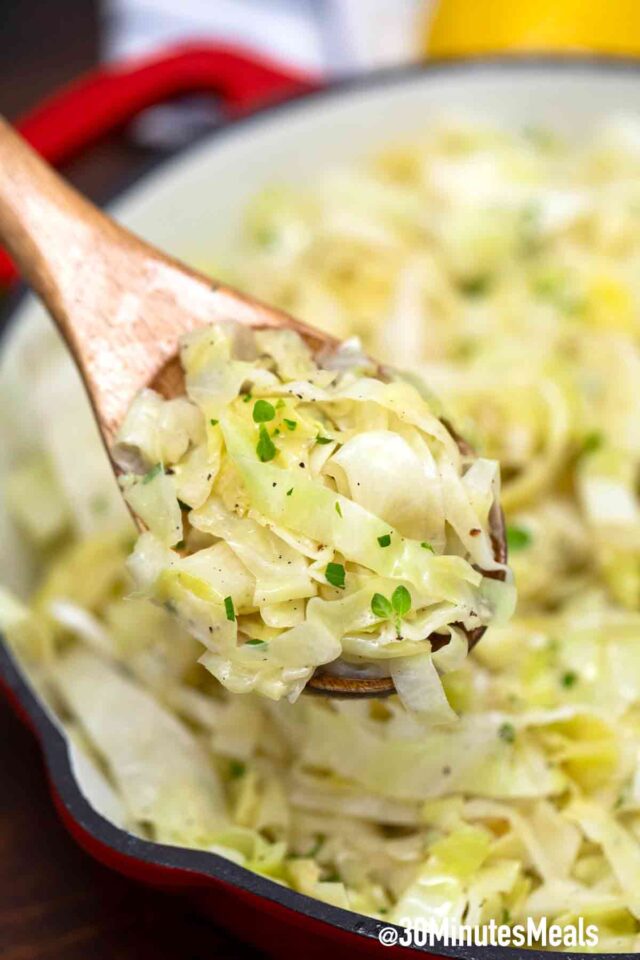 sautéed cabbage on a wooden spoon