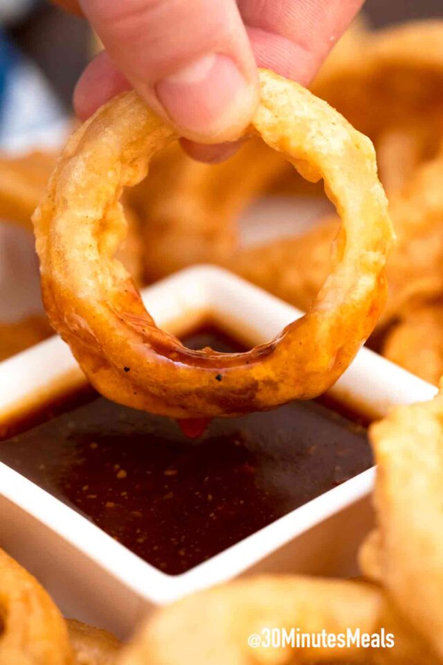 beer battered onion rings dipped in bbq sauce