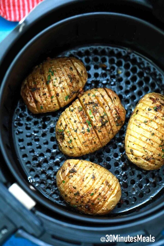 air fried hasselback potatoes in air fryer basket