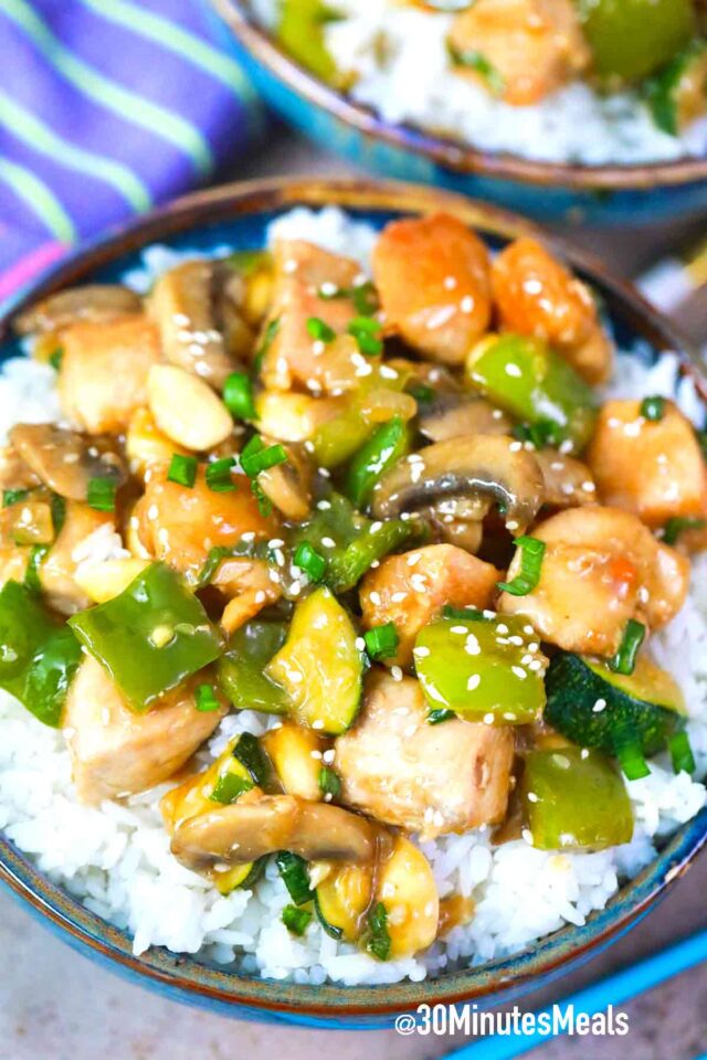 almond chicken on top of rice