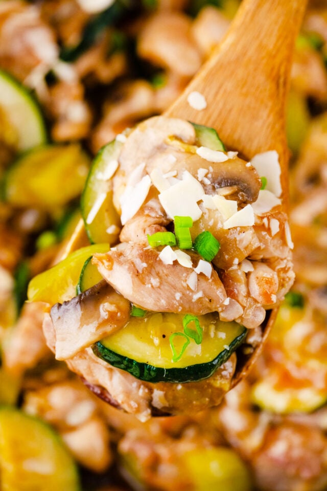 A serving spoon of almond chicken.