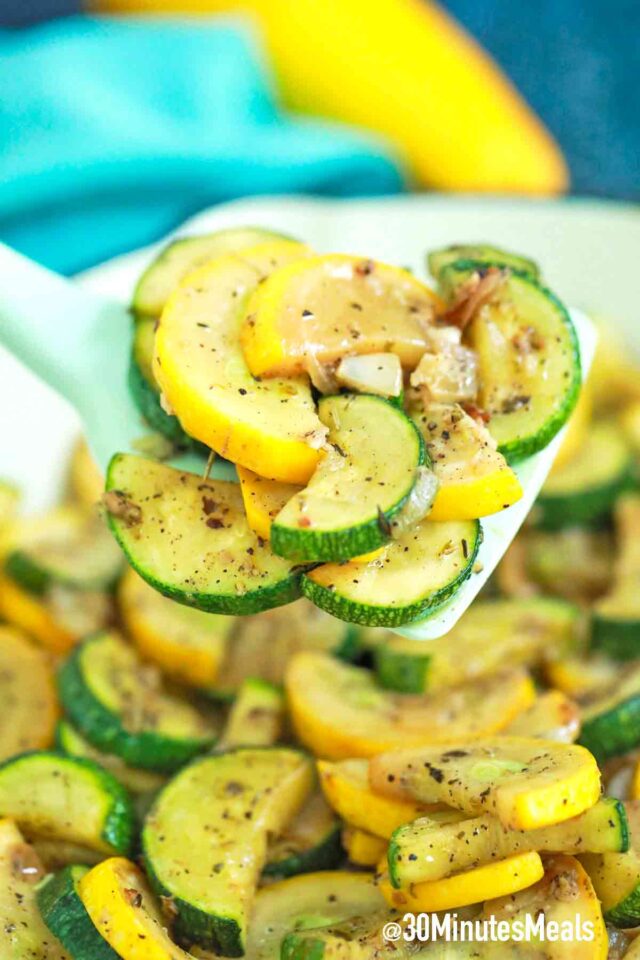 sautéed squash and zucchini on a serving spatula