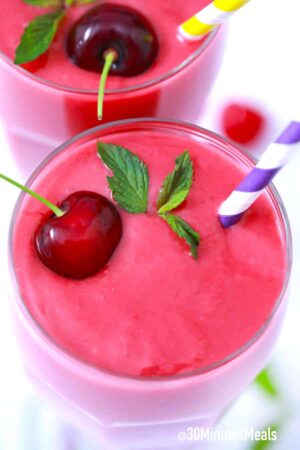 cherry smoothie with a fresh cherry