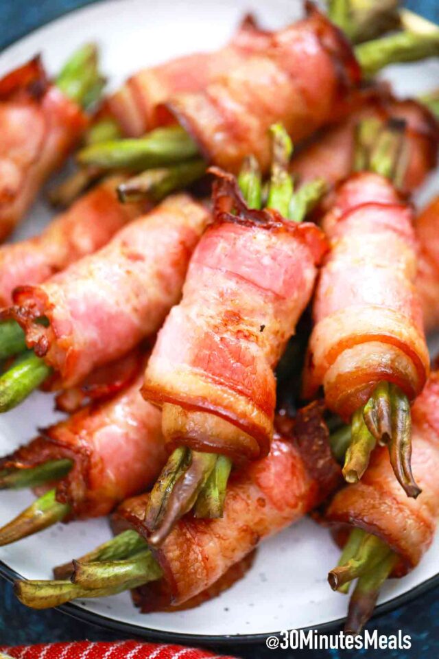 bundles of green beans wrapped in crispy bacon