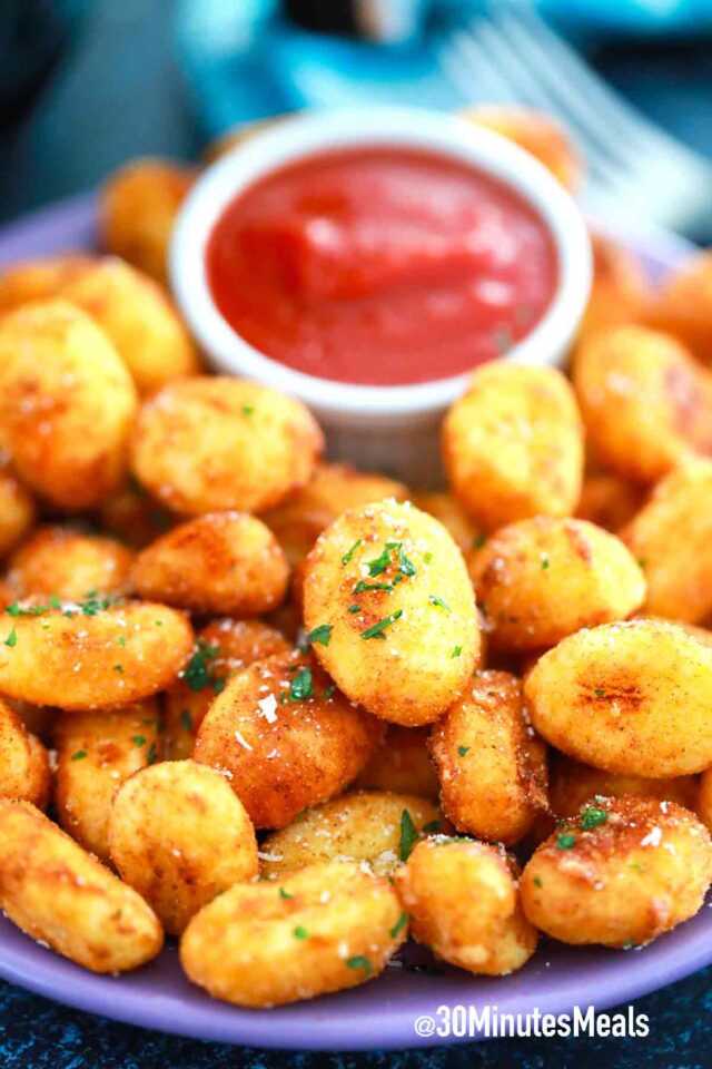 a plate of air fryer gnocchi with marinara sauce