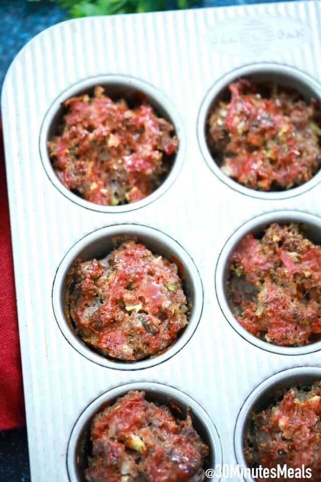 beef mixture in a muffin pan
