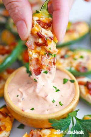 dipping air fryer jalapeno poppers in sauce