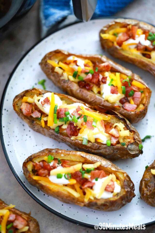potato skins with cheese on a plate