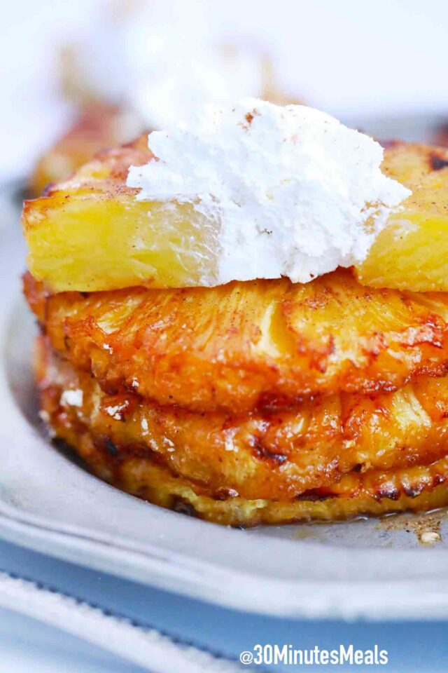 sliced air fried pineapple rings with whipped cream