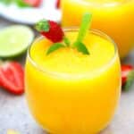 mango daiquiri served with a fresh strawberry