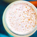 overhead shot of a glass of coquito de puerto rico