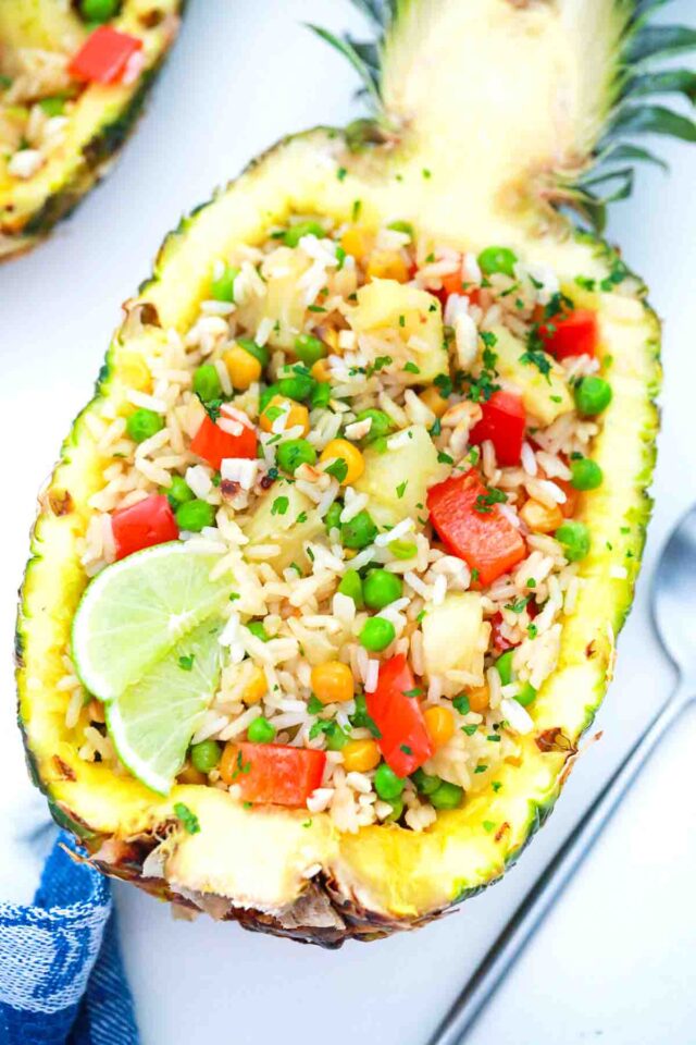 overhead shot of pineapple fried rice in a pineapple boat