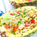 thai pineapple fried rice served in a fresh pineapple