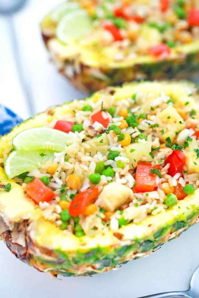 thai pineapple fried rice served in a fresh pineapple