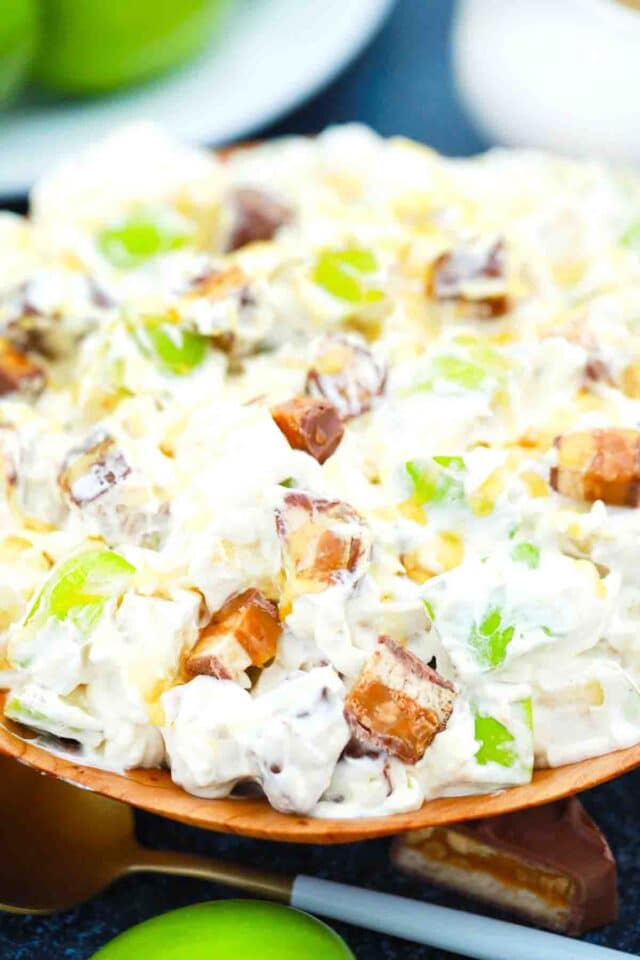 a bowl of creamy snickers apple salad