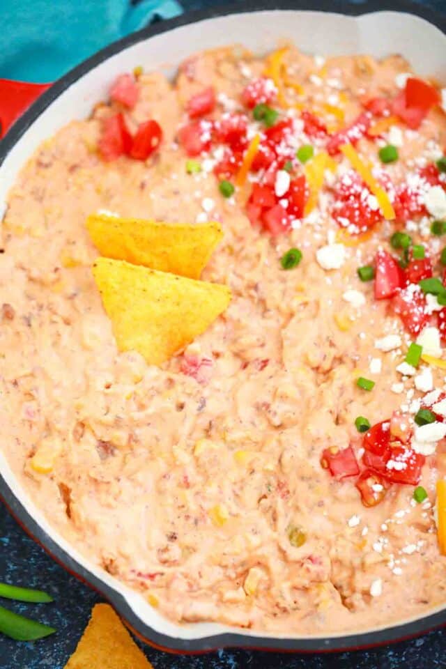 close overhead shot of velveeta spicy sausage dip recipe topped with salsa