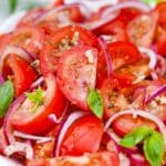 chopped red onion tomato salad macro shot