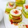 cucumber sushi roll cut into pieces and arranged on a plate
