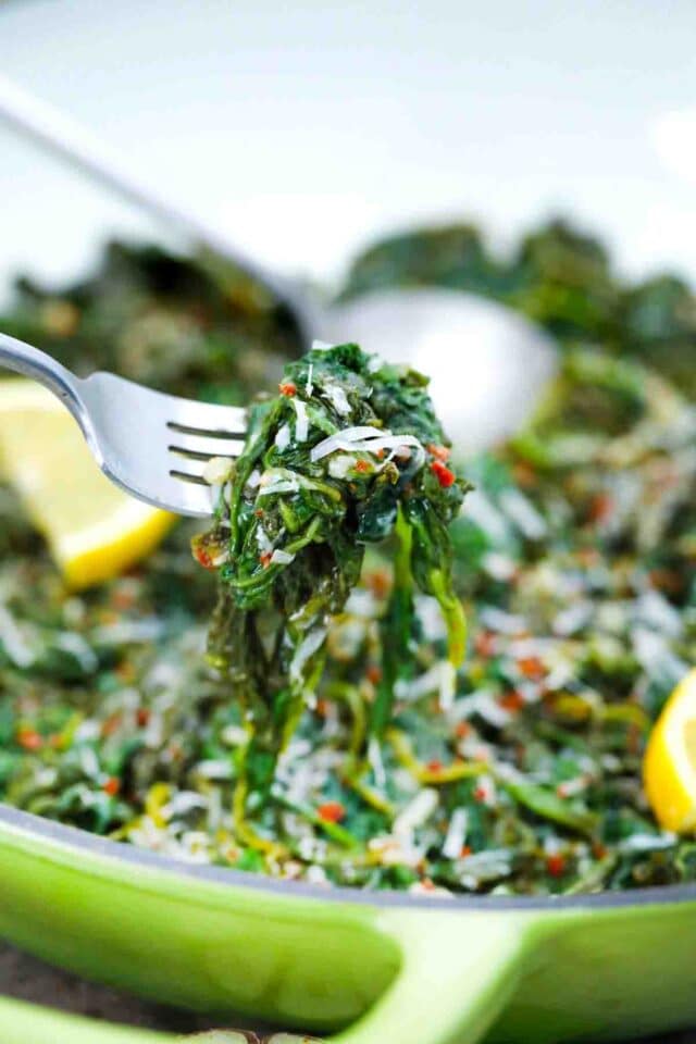 close shot of a fork with sauteed spinach