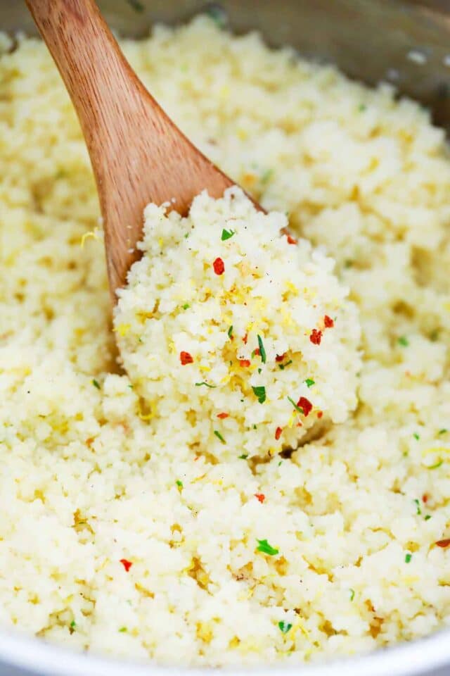 close shot of a wooden spoon with lemon couscous