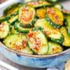 a bowl filled spicy cucumber salad