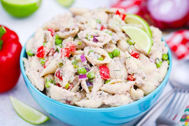 tuna pasta salad served with lime wedges
