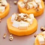 butternut squash rounds topped with sliced brie and walnuts