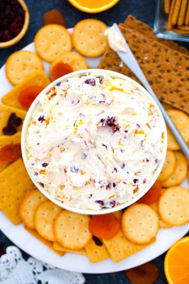 overhead shot of a bowl of cranberry cream cheese served with crackers