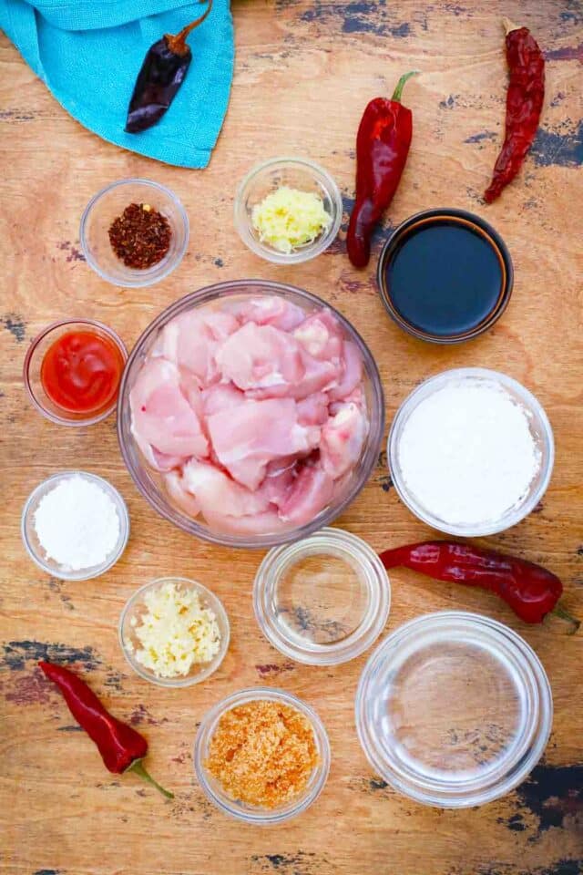 sweet and spicy chicken ingredients in bowls on a table