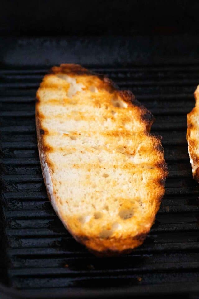 grilling a slice of sourdough