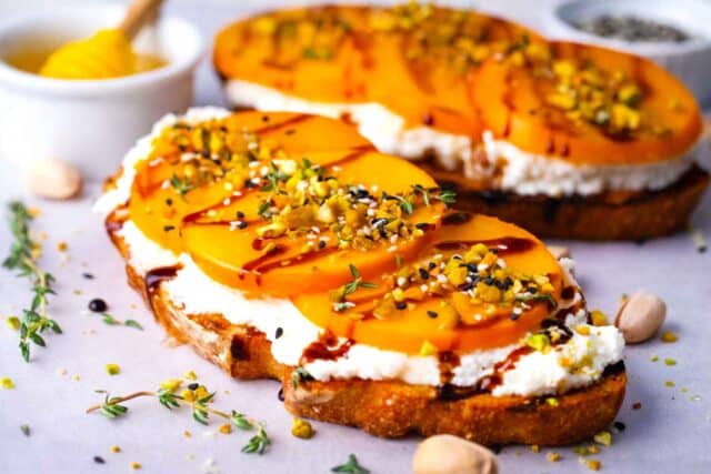 two slices of homemade persimmon toast with ricotta